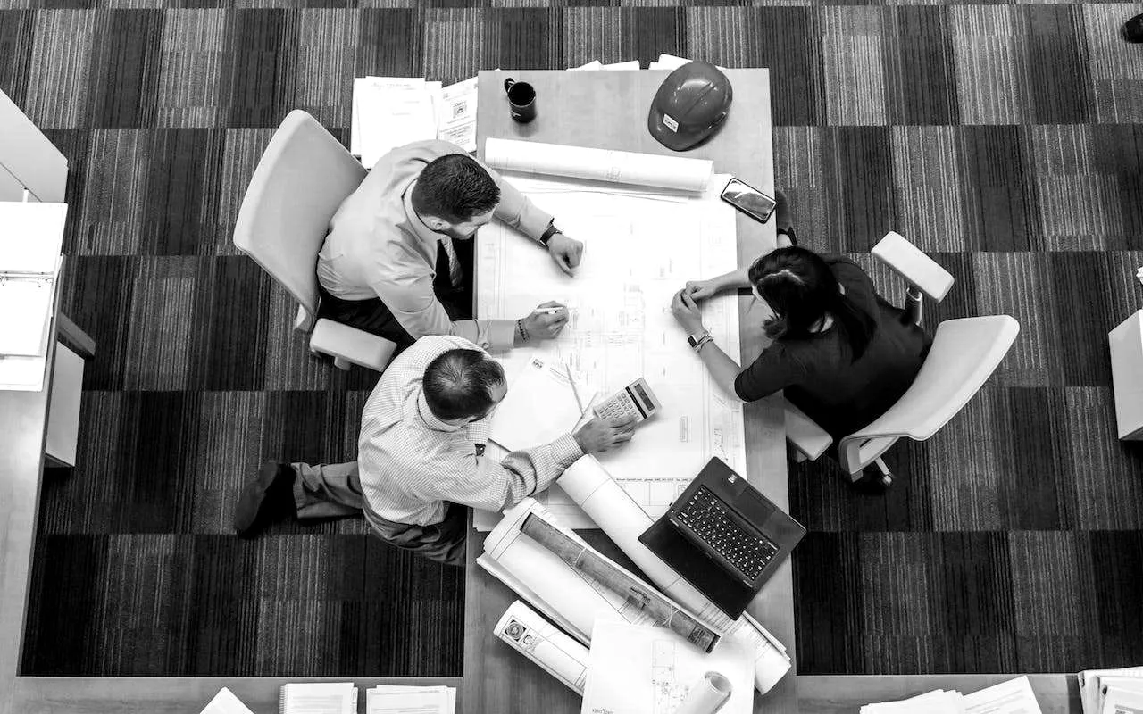 An overhead view of a team working through financial documents